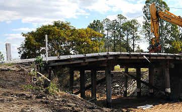 The historic Kilkivan railway bridge being demolished by Gympie Regional Council. The historic Kilkivan railway bridge being demolished by Gympie Regional Council.